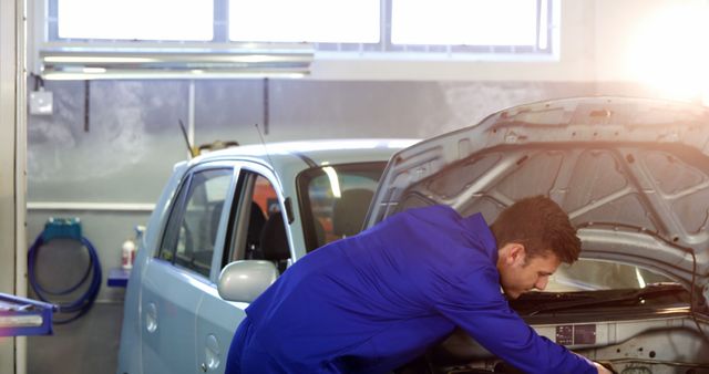 Auto Mechanic Repairing Car Engine in Workshop Garage - Download Free Stock Images Pikwizard.com