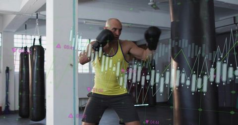 Athletic man boxing with data chart overlay in modern gym