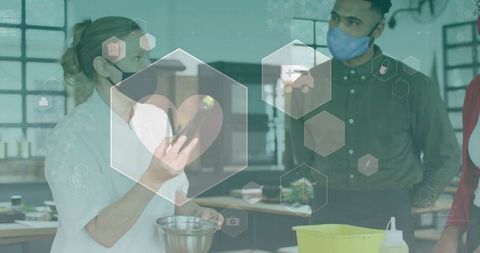 Chef cooking with digital health icons in professional kitchen