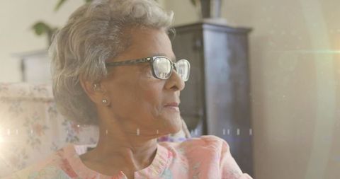 Thoughtful Senior Woman Reflecting at Home in Afternoon Light