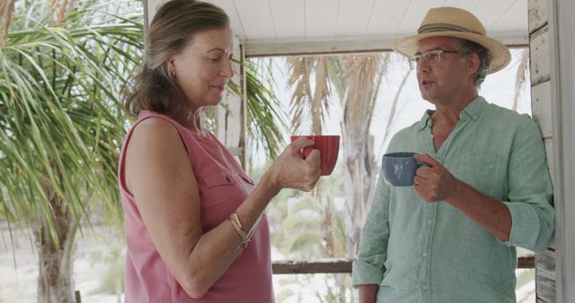 Senior Couple Enjoying Coffee on Tropical Balcony - Download Free Stock Images Pikwizard.com