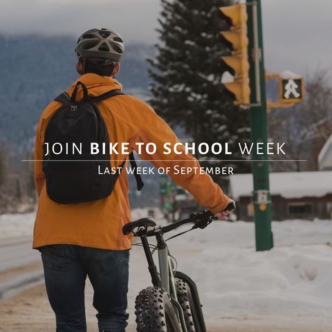 Student promoting 'bike to school week' in snowy neighborhood