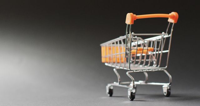 Miniature Shopping Cart on Dark Background - Download Free Stock Images Pikwizard.com