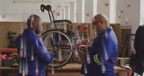 Technicians repairing wheelchair using mobile device in workshop with digital overlay