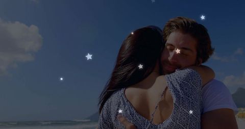 Couple Embracing on Tranquil Beach with Calm Sea