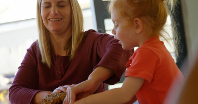 Mother and Daughter Bonding at Breakfast Table - Download Free Stock Images Pikwizard.com