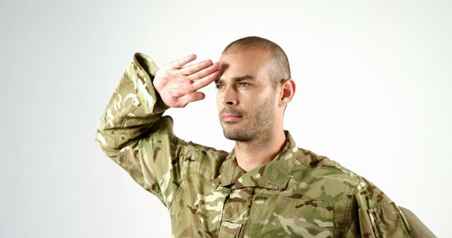 Military Officer Saluting in Full Uniform Against Plain Background - Download Free Stock Images Pikwizard.com