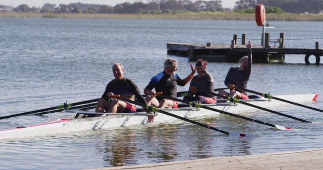 Rowers Celebrating Teamwork on Calm Lake - Download Free Stock Images Pikwizard.com