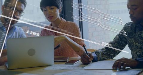 Diverse team collaborating on modern business technology