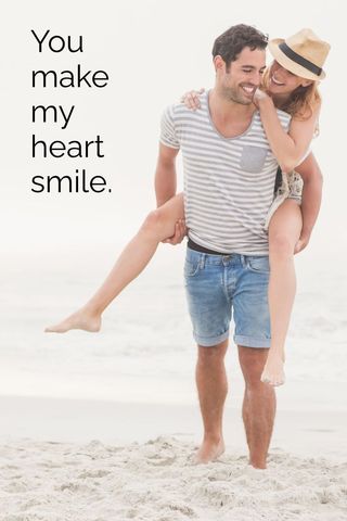 Joyful Couple Enjoying Romantic Beach Vacation
