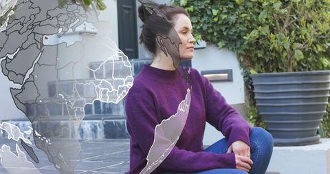 Woman Sitting Porch Steps Wearing Purple Sweater and Jeans with Globe Overlay and Ivy