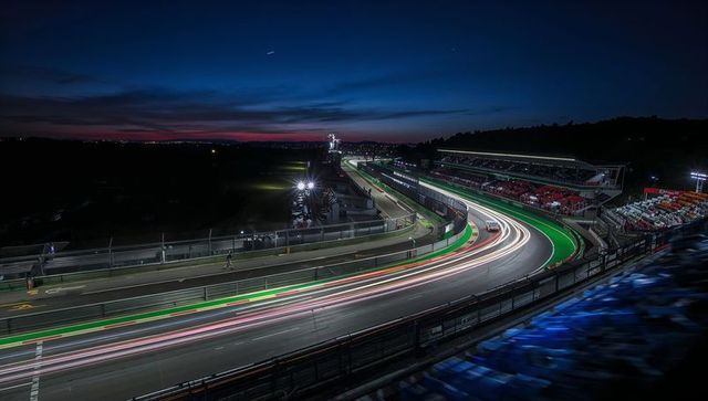 Dramatic Night Race Circuit with Light Trails and Engineering Marvel