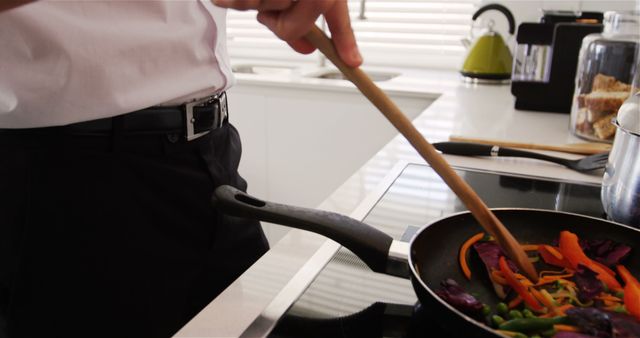 Man Cooking Fresh Vegetables in Modern Kitchen - Download Free Stock Images Pikwizard.com