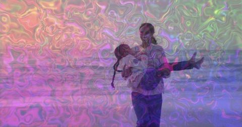 Mother and Daughter Strolling Along Beach in Dreamy Colors