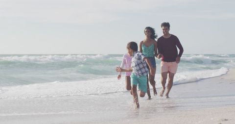Family Enjoying Beach Run Together on Sunny Day - Download Free Stock Images Pikwizard.com
