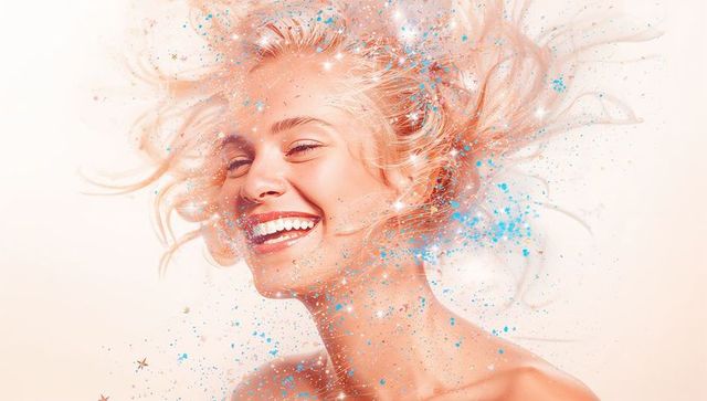 Smiling Blonde Woman Sparkling with Blue and Gold Confetti, Joyful Pastel Beauty Portrait
