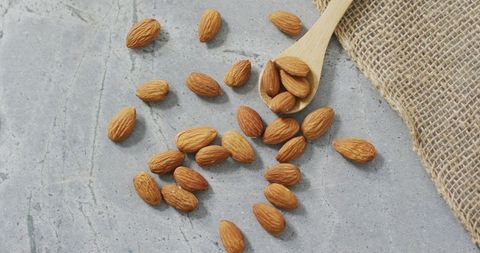 Raw Almonds on Stone Surface with Burlap Fabric - Download Free Stock Images Pikwizard.com