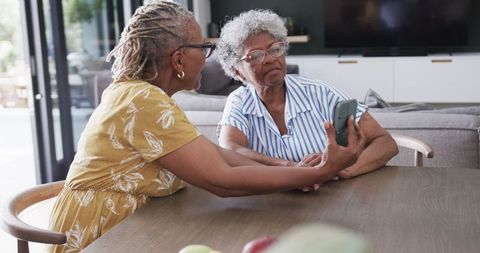 Senior Women Socializing with Smartphone at Home