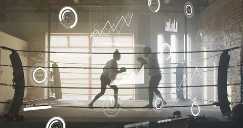 Sparring coach holding pads and boxer training in industrial gym with hud performance analytics