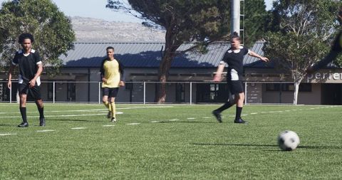 High School Soccer Training on Green Field Outdoors