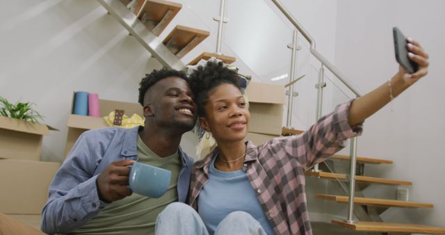 Image of happy african american couple taking selfie after moving into new house - Download Free Stock Photos Pikwizard.com