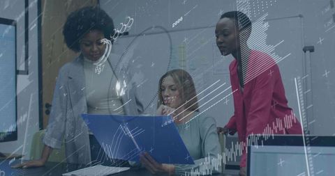 Diverse team reviewing financial reports with digital charts overlay in modern office