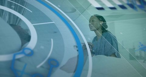 Nurse monitoring patient with digital health tools in modern hospital