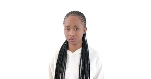 Confident young woman with braided hair in modern fashion