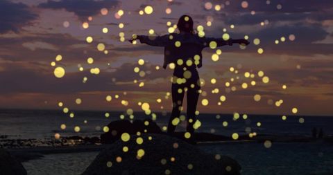 Silhouette Woman Embracing Sunset with Warm Bokeh