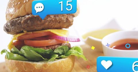 Gourmet Beef Burger with Cheese and Vegetables Enhanced by Social Media Icons