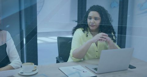 Diverse Business Team Collaborating with Digital Overlay in Modern Office