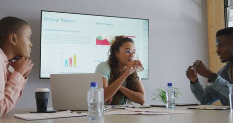 Diverse Team Discussing Business Reports and Ideas