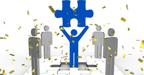 Business Team Celebrating Success with Puzzle Symbol