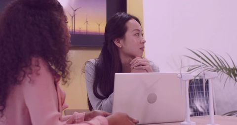 Renewable energy meeting with wind turbine and solar model