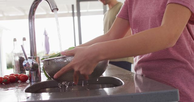 Woman Washing Fresh Vegetables in Modern Kitchen - Download Free Stock Images Pikwizard.com