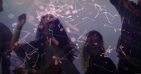 Group of Friends Enjoying Energetic Nightclub Experience