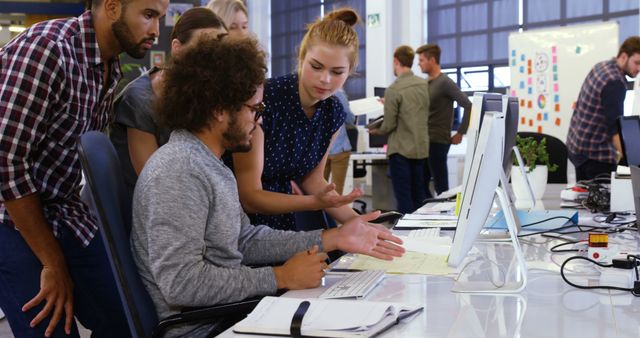 Diverse Team Collaborating at Modern Office Workstation - Download Free Stock Images Pikwizard.com