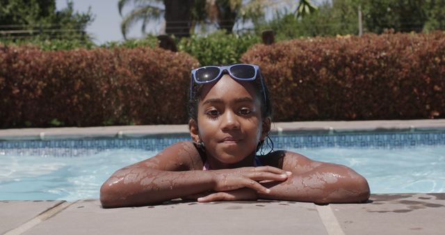 Biracial Girl Enjoying the Sun by the Poolside - Download Free Stock Images Pikwizard.com