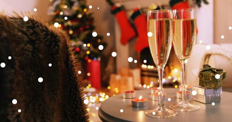 Cozy Christmas Celebration with Champagne and Fireplace