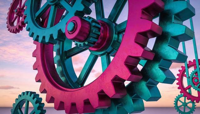 Rotating teal-magenta gears meshing on reflective plane at soft sunset engineering