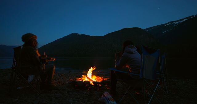 Campers Enjoying Bonfire by Mountain Lake at Night - Download Free Stock Images Pikwizard.com
