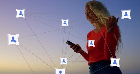 Woman Engaging with Social Media Network On Smartphone