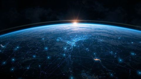 Orbiting sunrise over Earth revealing glowing global network and futuristic connections