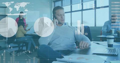 Businessman calling and checking watch in open-plan coworking space with financial overlays