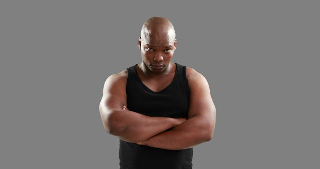 Confident African American Man with Strong Expression and Crossed Arms - Download Free Stock Images Pikwizard.com