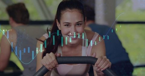 Young woman pedaling indoor bike with data overlay for fitness tracking analytics