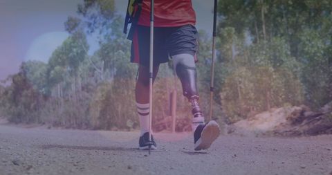 Man with Prosthetic Leg Journeying Through Mountain Path