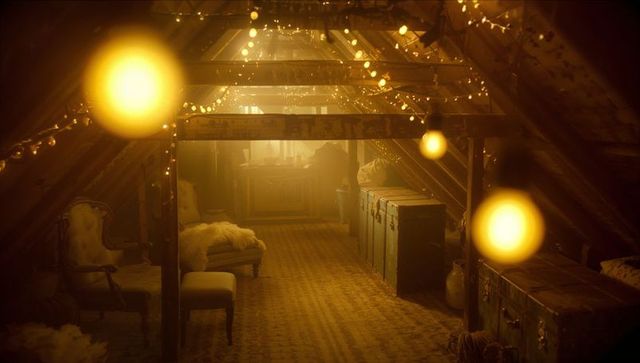 Cozy warm attic with string lights and practical storage