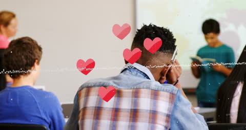Students Engaging in Classroom Reading Activity with Heart Icons