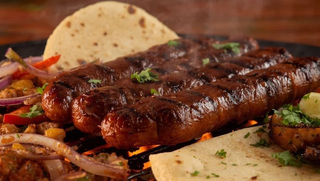 Barbecue kebabs with flatbreads on outdoor grill